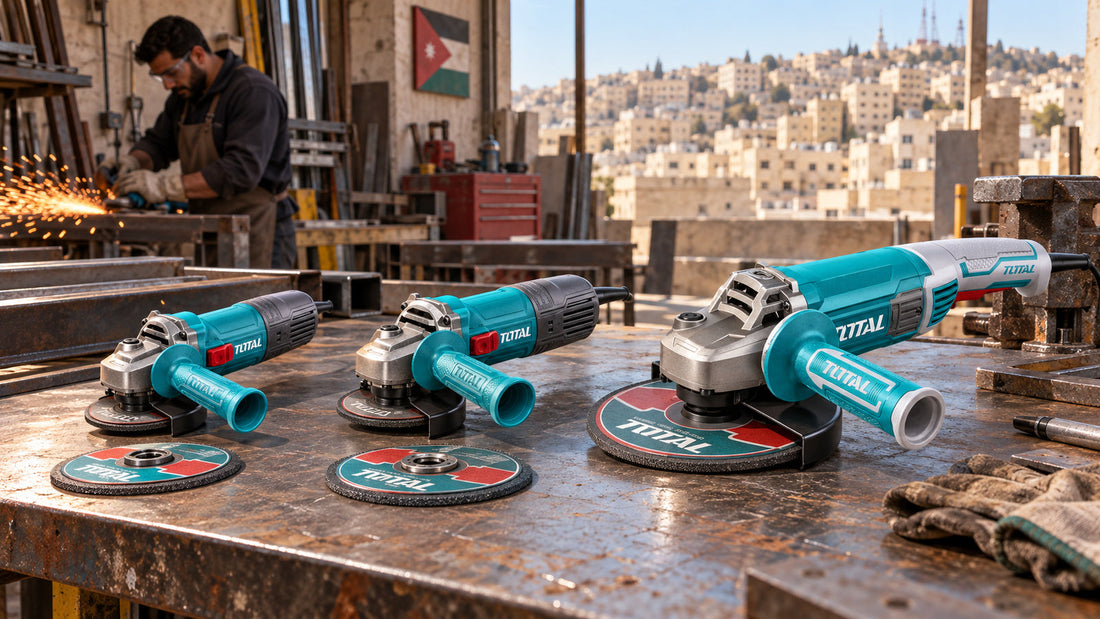 Three angle grinders, 115mm, 125mm and 230mm, on a steel workbench with cutting discs